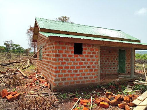 In Guinea, a volunteer worked to improve a community’s access to HIV/AIDs health professionals by enhancing a local health clinic.