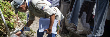 A health professional holding a clipboard