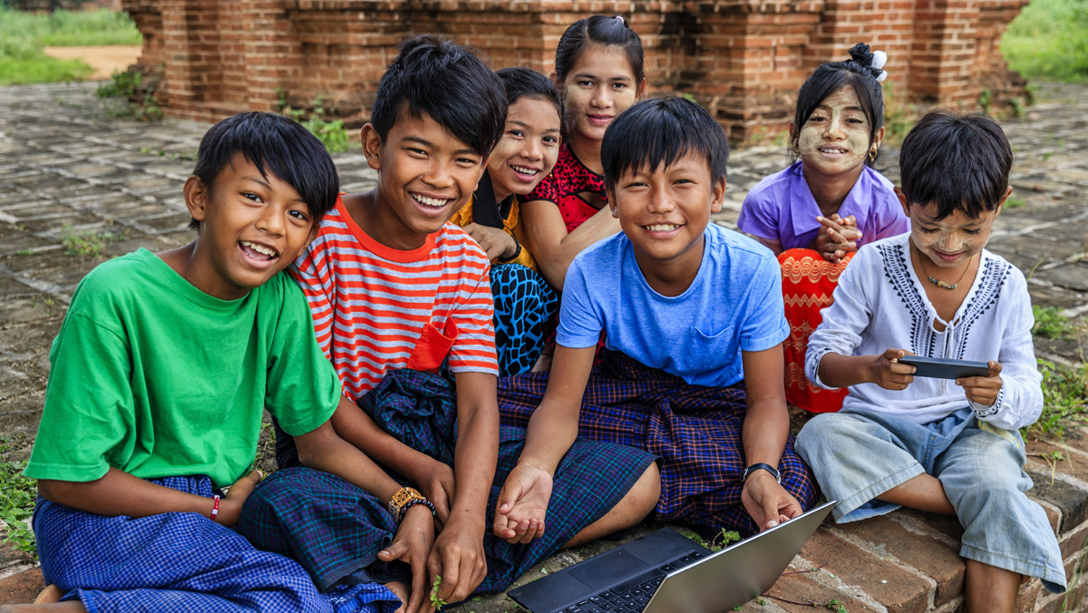 A group of children smiling for the camera