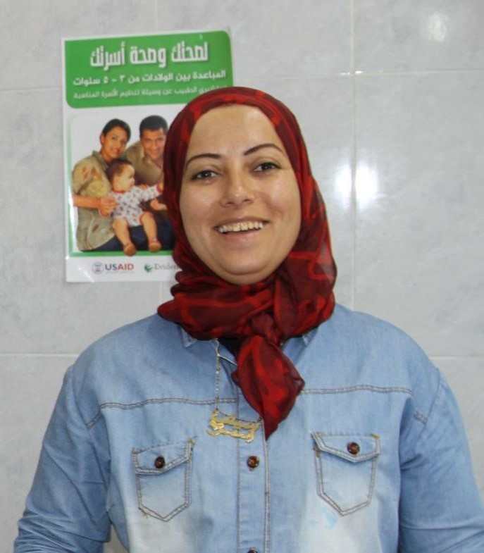 A health worker stands in front of signage in a garment factory clinic in Port Said.