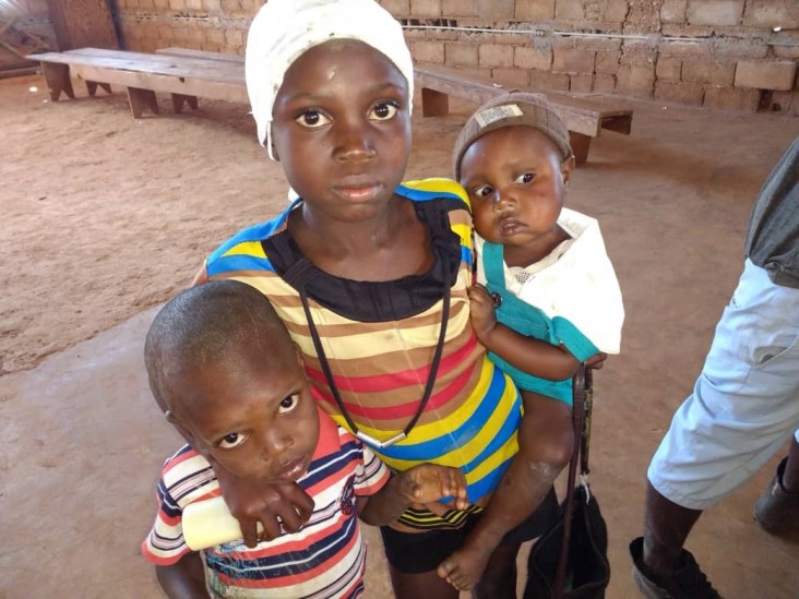 Girl seen with her two younger siblings at the Ambulatory Treatment Unit in Belle-Fontaine, Haiti. 