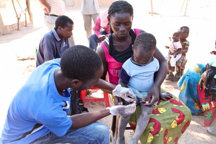 A young boy is tested for malaria as part of the Impact Malaria project