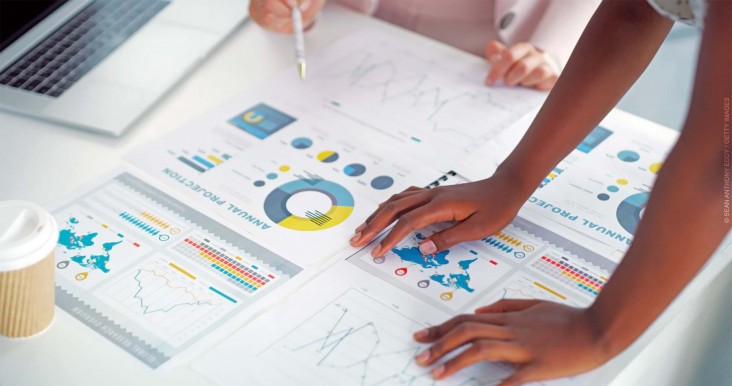 Closeup shot of two businesswomen analysing graphs in an office