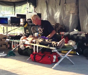 Urban search-and-rescue member Jeff Britton tends to a patient after the 7.3 magnitude aftershock in Nepal on May 12