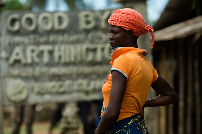 The mother of Phelica Anthony, 6, says goodbye to her daughter as a Liberian Red Cross burial team takes her body away.  