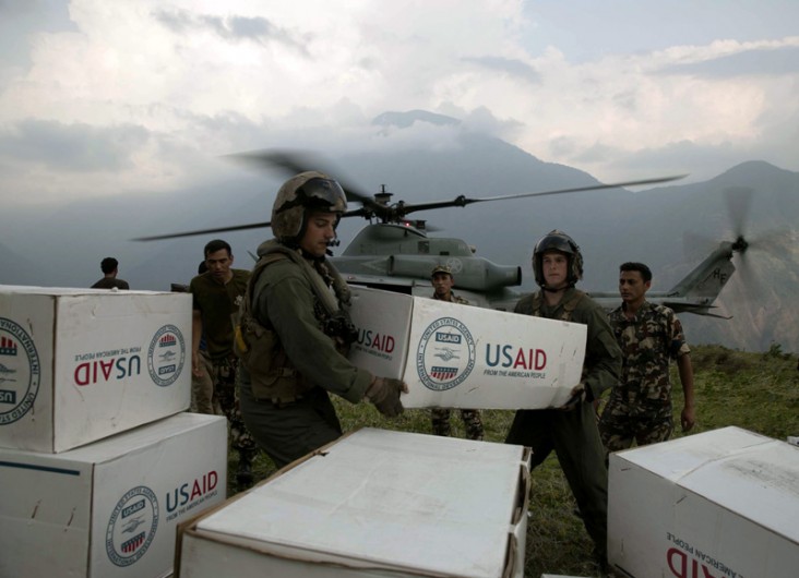 U.S. Marines and Nepalese soldiers unload tarps off of a UH-1Y Huey at Orang, Nepal, May 19 during operation Sahayogi Haat, “hel