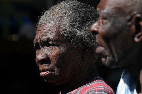 Voters arrive at a polling center in Carrefour on March 20, 2011, in the second round of the presidential elections. 