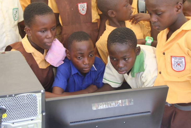 Children are captivated by computer reading applications at the reading festival in Accra.