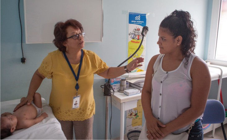 A mother and her baby visit a Zika clinic