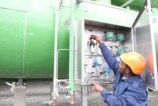 A man works on an electrical box