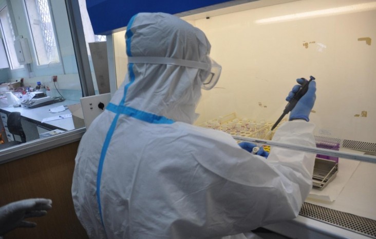 Jeremiah processes a specimen for COVID-19 testing at Coast Provincial General Hospital in Mombasa. 