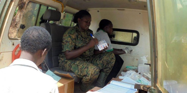 A health worker dispenses antiretroviral medication to a client during a satellite clinic in Ntungamo-Mubende, Uganda.