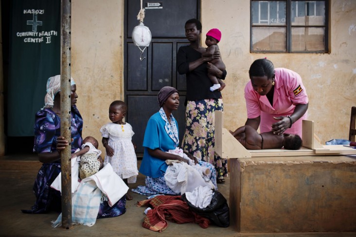 Juliet Nanziwa, a 30-year-old nurse, administers vaccines and weighs and measures babies at a newly opened health centre in Nondwe Iganga, Uganda. Photo credit: Kate Holt/MCSP