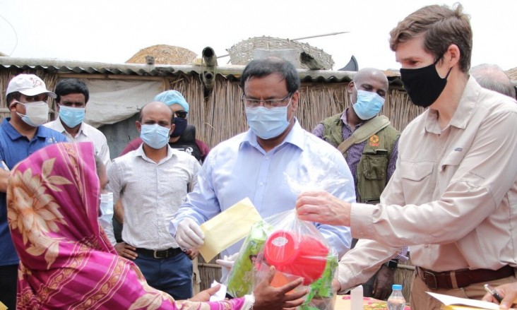 Ambassador Earl Miller meets with families in Madhya Khatiamari village receiving emergency relief from a U.S. government-funded program.