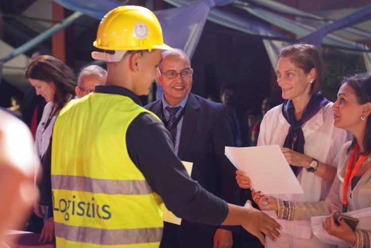 USAID/Egypt Mission Director Sherry F. Carlin hands out certificates to the first cohort of graduates from the technical school logistics specialization.