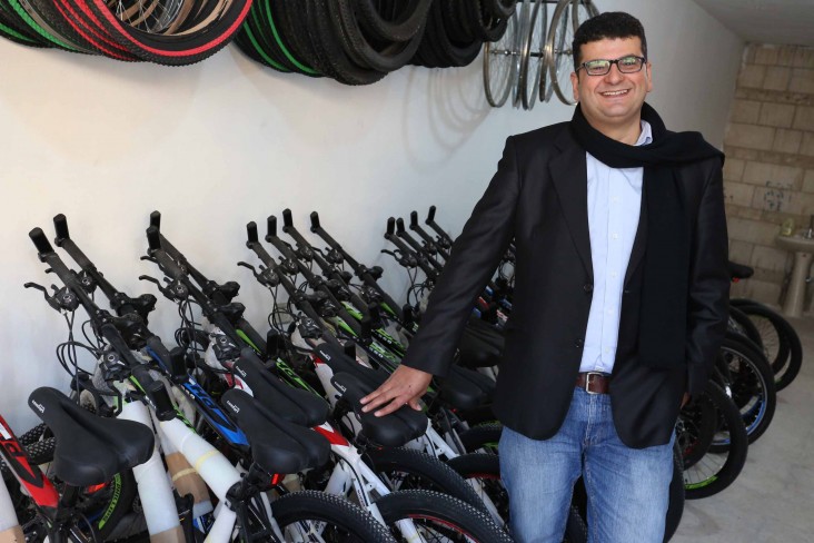 Ala Daibes, owner of North Jordan Mountain Bike Center, stands in his shop shortly after the grand opening. 