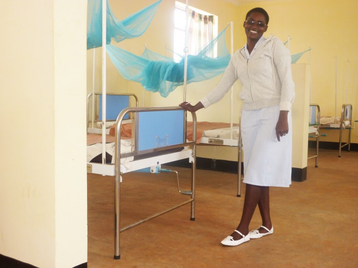 A nurse at the Kibaigwa Health Center shows off the newly completed women’s ward.