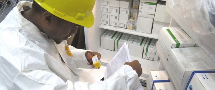 A warehouse staffer checks new stock of life-saving drugs for Guyana’s HIV/AIDS population.