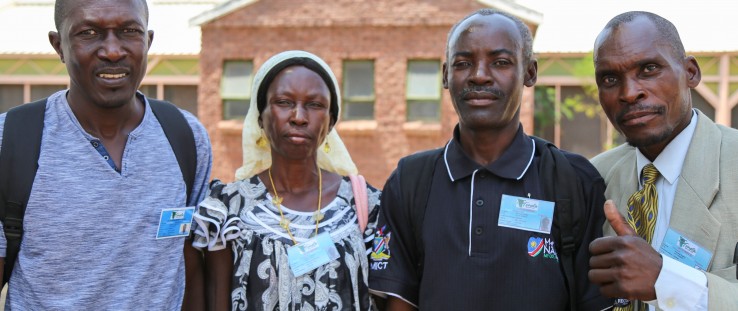 Members of Let’s Unite wear their support group ID cards provided by TONATA.