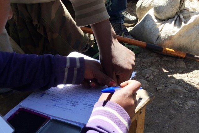 To ensure that each household gets its proper allotment, recipients sign for their emergency food rations with thumb prints.