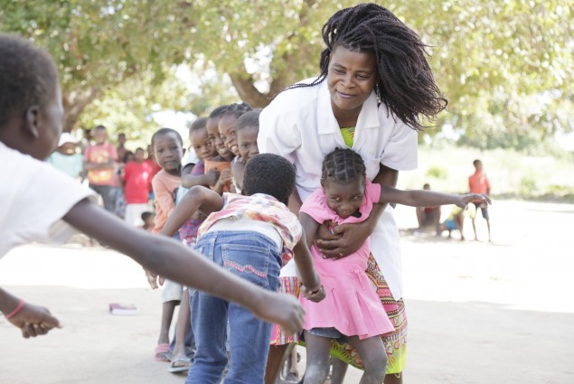 Teacher and pupils having fun