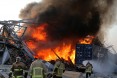 Lebanese firefighters extinguish fire at the scene of an explosion at the port in the  capital Beirut on August 4, 2020. 