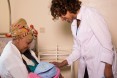 Midwife Yodit Meseret does a post-delivery check up with a new mother, Yeshi Getachew, at the Bole Health Center.