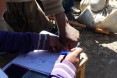 To ensure that each household gets its proper allotment, recipients sign for their emergency food rations with thumb prints.