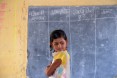 Students are divided into small groups, with local volunteers assigned to each group. Each group elects a spokesperson to presen