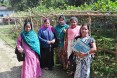 Five community health workers stand together outside.