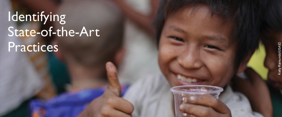 Identifying State-of-the-Art Practices - A young with a glass of water gives a thumbs-up.