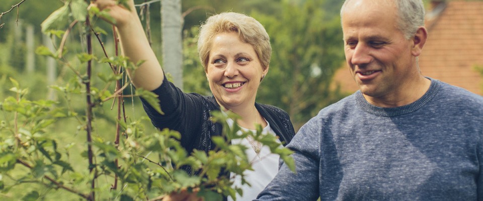 A couple in Kosovo checking on their plants