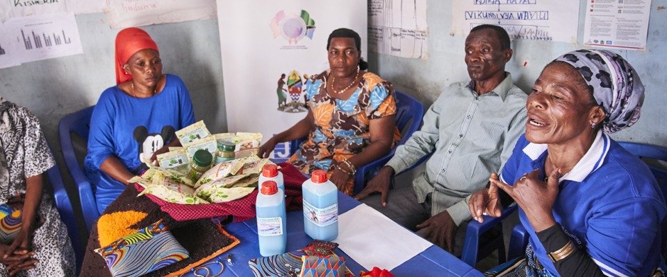 Jane Mwaliego (far right) leads her local group to support community members to get tested for HIV and, if found to be positive, to start and stay on treatment.