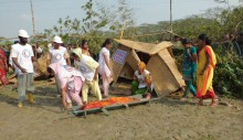 At a USAID-supported cyclone simulation, CPP volunteers practice search and rescue.