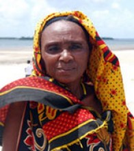 An Aweer woman stands near a mangrove forest and coastline in Lamu, Kenya. Credit: Samia Omar Bwana, Kibodo Trust and SECURE