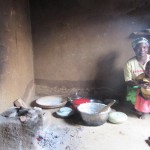 Merifa Muvwera and daughter, Loveness, portioning nsima, Malawi’s staple food, after preparing the meal on their improved cookst