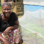 Respect shows off her newly grown peppers