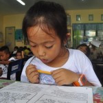 Young Girl in Rural Philippines Braves the Sea to Read and Learn