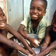 Children wash their hands in Ghana, where USAID supports prevention and treatment of trachoma, a blinding eye disease.