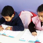 Two Moroccan students reading from their textbooks