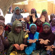 Nigerien girls discuss hand washing in a community Safe Space club