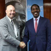 USAID Mission Director for Kenya and East Africa Mark Meassick (L) and the Trade and Industry Cabinet Secretary Peter Munya during the Generation Kenya graduation ceremony. USAID supports the initiative which trains youth to learn the skills they need for entry-level jobs.