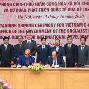 U.S. Ambassador to Vietnam Daniel J. Kritenbrink joins other distinguished guests to witness while USAID/Vietnam Acting Mission Director Bradley Bessire and Vietnam's Office of the Government (OOG) Chairman Mai Tiến Dũng sign the MoU.