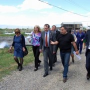 group of people walking through a fishery