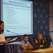 Woman speaks at a podium during a public event.