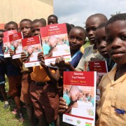 P2 Pupils of Sowodadzen Primary School in the Jomoro District of the Western Region displaying the materials the school received.