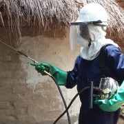 IRS Spray Operator spraying eaves in Butaleja District