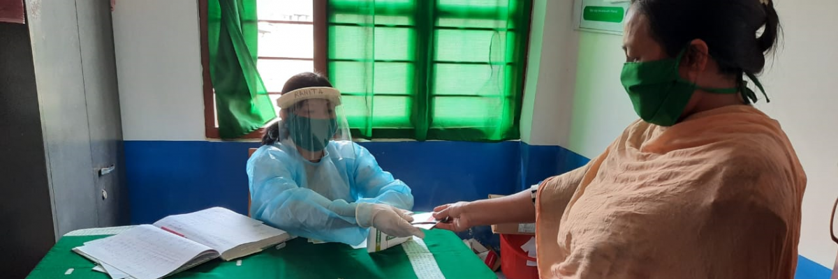 A community health worker providing medicines to patients at Heath and Wellness Center supported by USAID in the state of Manipur. Photo Credit: NISHTHA/USAID