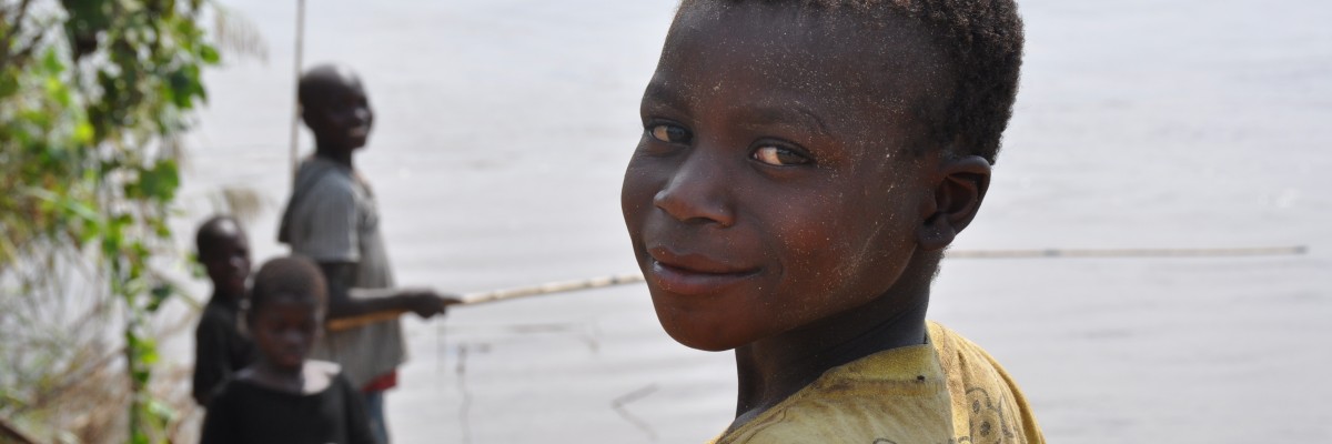 Boys fishing on the side of Vinho river in the Gorongosa National Park, center of Mozambique. 