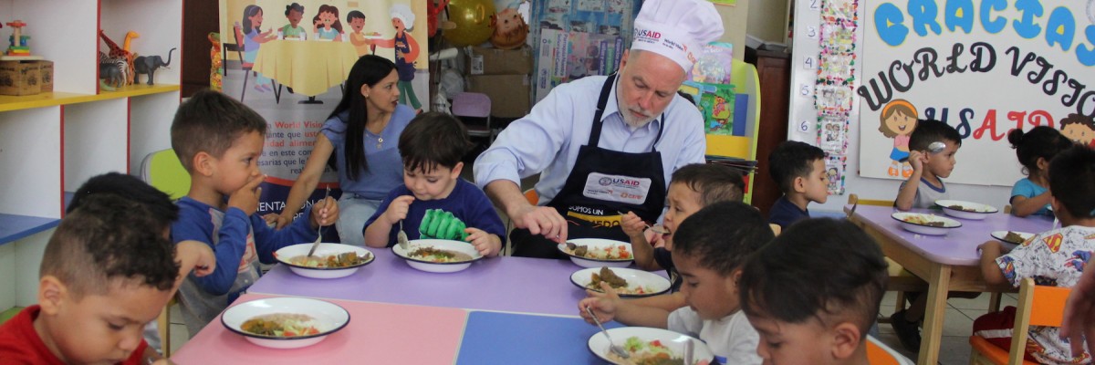 SERVING HOT MEALS TO VENEZUELAN AND PERUVIAN CHILDREN